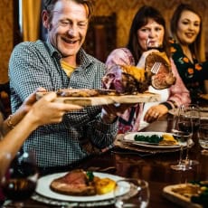 man slicing a roast